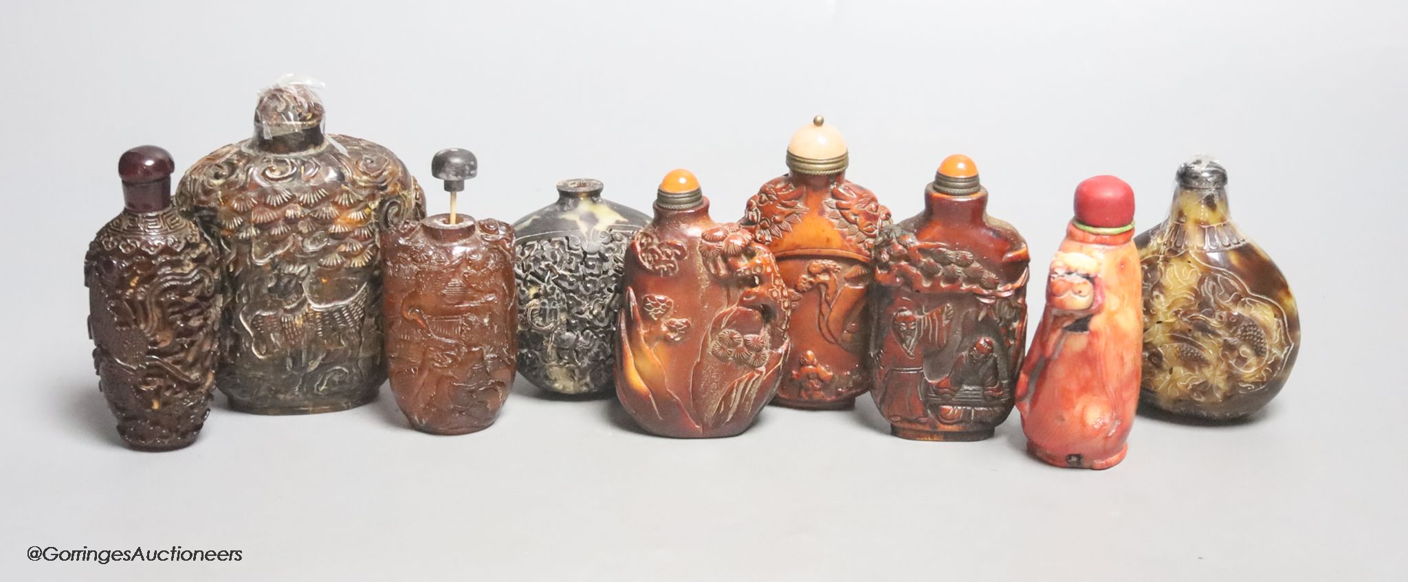 A collection of Chinese horn, tortoiseshell and coral etc. snuff bottles